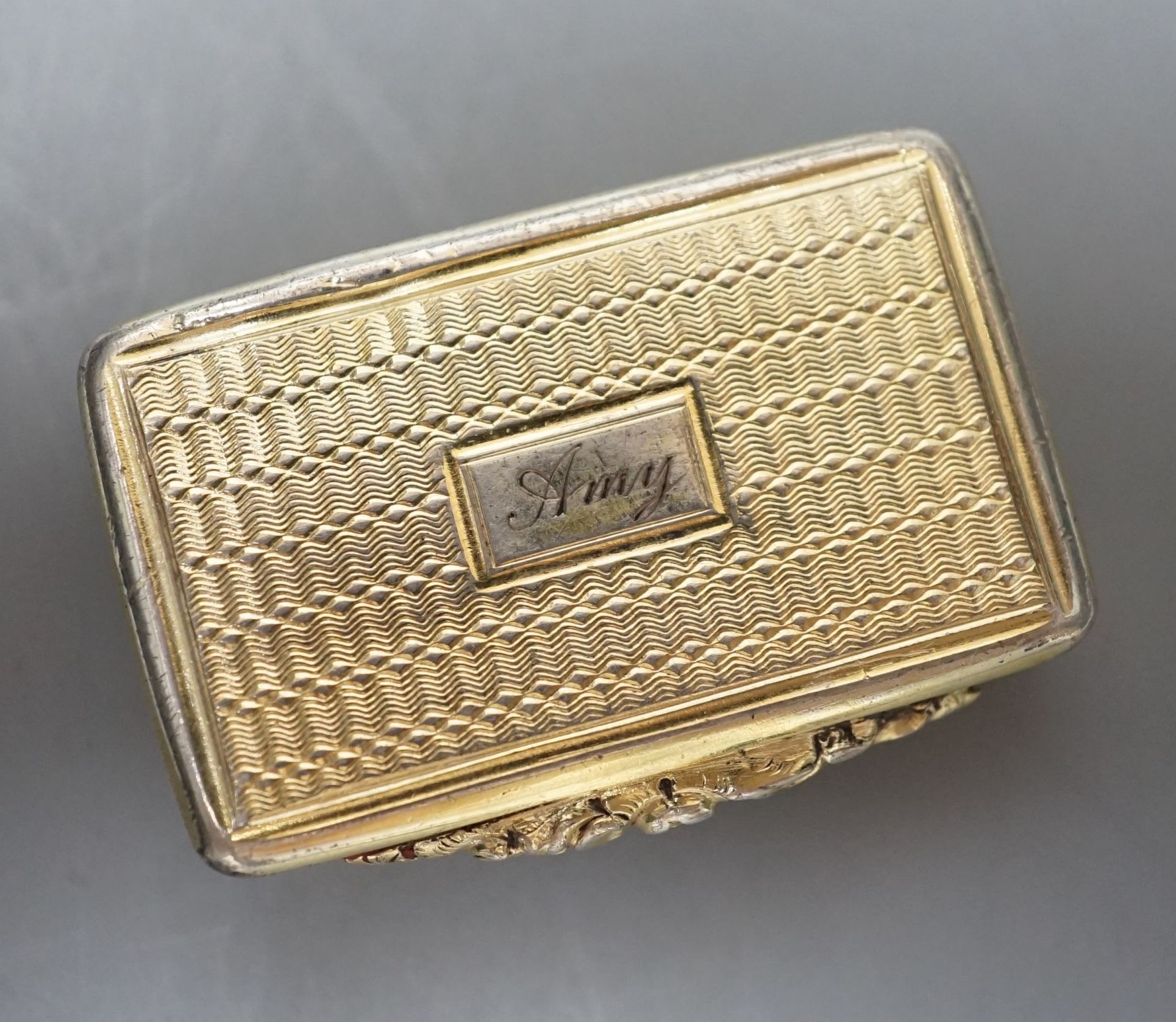A George IV engine turned silver gilt rectangular vinaigrette, Thomas Wilmore, Birmingham, 1821, 38mm.